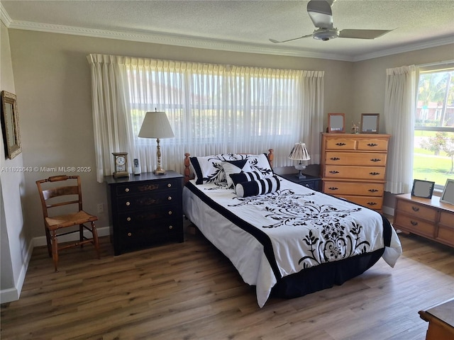 1101 SW 75th Ter, Plantation, FL 33317 - bedroom featuring crown molding, wood finished floors, a textured ceiling, and a ceiling fan