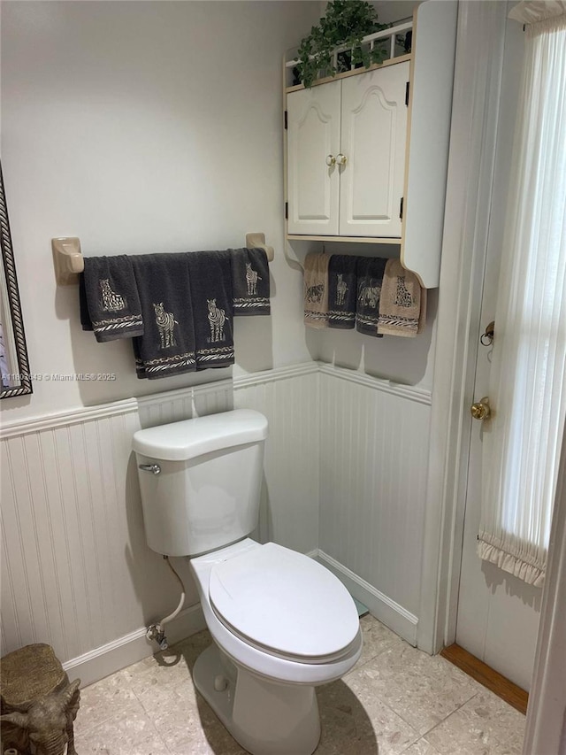 1101 SW 75th Ter, Plantation, FL 33317 - bathroom with toilet, wainscoting, and baseboards