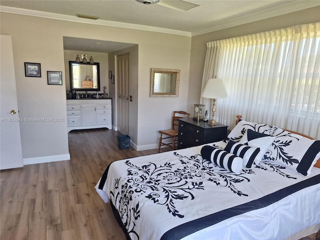 1101 SW 75th Ter, Plantation, FL 33317 - bedroom with wood finished floors, crown molding, and ensuite bathroom