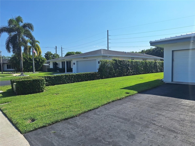 1101 SW 75th Ter, Plantation, FL 33317 - view of side of home featuring stucco siding, a yard, and asphalt driveway