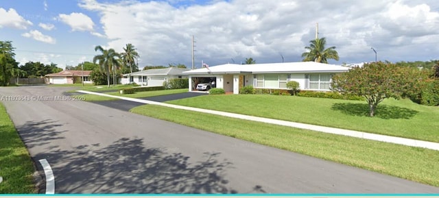 1101 SW 75th Ter, Plantation, FL 33317 - ranch-style house with driveway, an attached carport, and a front lawn