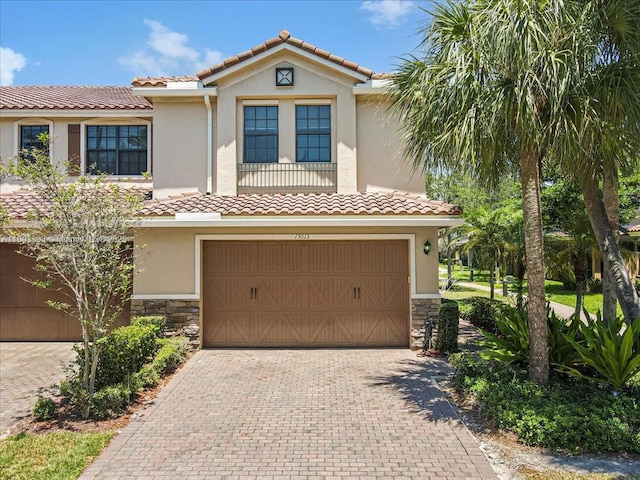13013 S Riverwalk Cir S, Plantation, FL 33325 - mediterranean / spanish home with stone siding, decorative driveway, and stucco siding