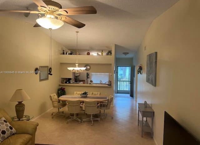dining area with tile patterned floors and a chandelier