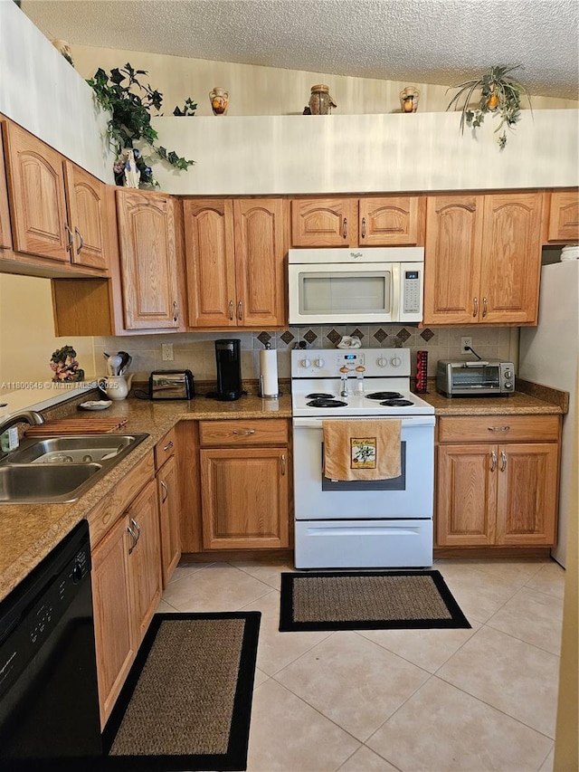 1301 Sabal Ridge Cir Unit G, Palm Beach Gardens, FL 33418 - kitchen with white appliances, a sink, a textured ceiling, light tile patterned floors, and tasteful backsplash