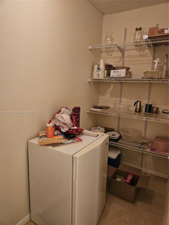 1301 Sabal Ridge Cir Unit G, Palm Beach Gardens, FL 33418 - laundry room with tile patterned flooring