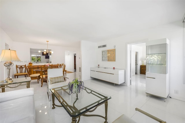 1 Harbour Way Unit 305, Bal Harbour, FL 33154 - living room with light tile patterned floors and a chandelier