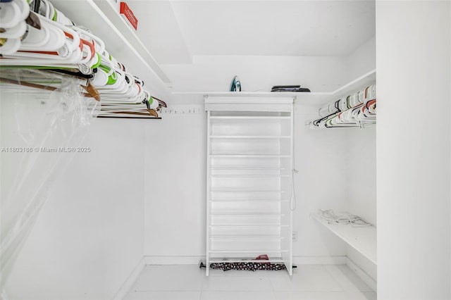 1 Harbour Way Unit 305, Bal Harbour, FL 33154 - walk in closet featuring tile patterned flooring