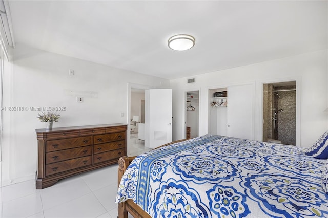 1 Harbour Way Unit 305, Bal Harbour, FL 33154 - bedroom with light tile patterned floors, ensuite bathroom, and a closet