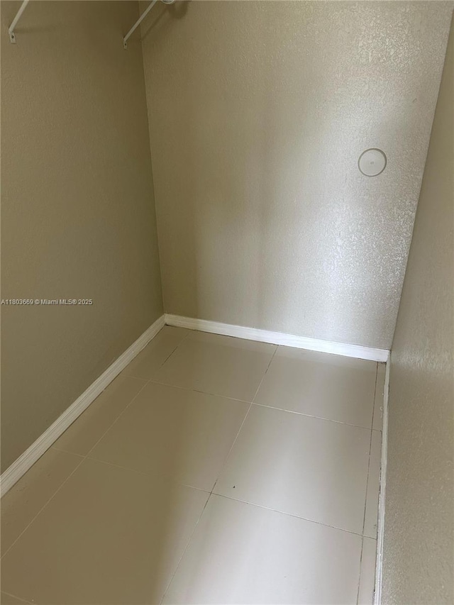 61 NE 13th Ave Unit 11, Homestead, FL 33033 - spacious closet with tile patterned flooring
