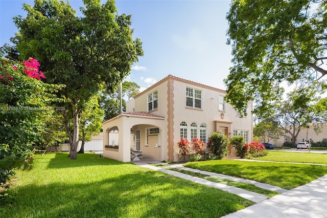 1801 SW 12th St, Miami, FL 33135 - mediterranean / spanish house with a tile roof, a front yard, and stucco siding
