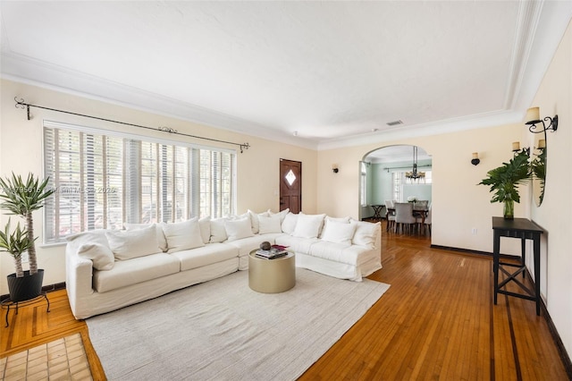 1801 SW 12th St, Miami, FL 33135 - living room featuring arched walkways, wood-type flooring, crown molding, and a chandelier