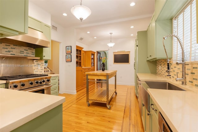 1801 SW 12th St, Miami, FL 33135 - kitchen featuring green cabinetry, high end stove, under cabinet range hood, backsplash, and recessed lighting