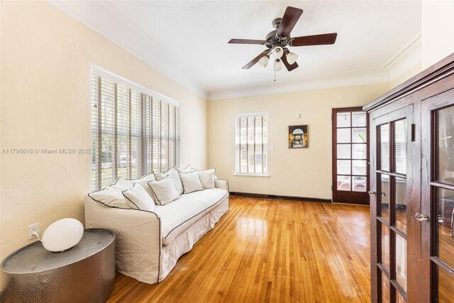 1801 SW 12th St, Miami, FL 33135 - living room with ornamental molding, light wood-style floors, a ceiling fan, and baseboards