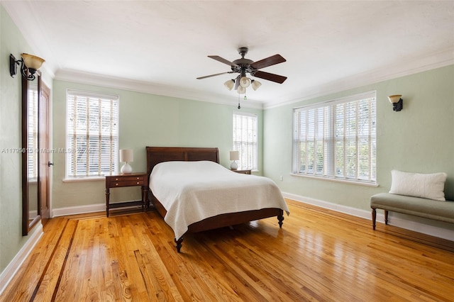 1801 SW 12th St, Miami, FL 33135 - bedroom with crown molding, baseboards, multiple windows, light wood-type flooring, and ceiling fan