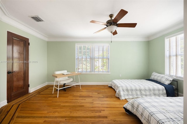 1801 SW 12th St, Miami, FL 33135 - bedroom with multiple windows, wood finished floors, ornamental molding, baseboards, and ceiling fan