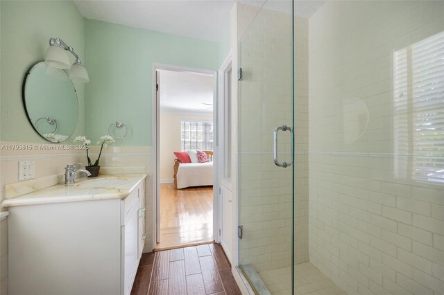 1801 SW 12th St, Miami, FL 33135 - ensuite bathroom featuring wood finished floors, a stall shower, and vanity