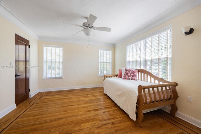 1801 SW 12th St, Miami, FL 33135 - bedroom with light wood-style flooring, crown molding, and baseboards