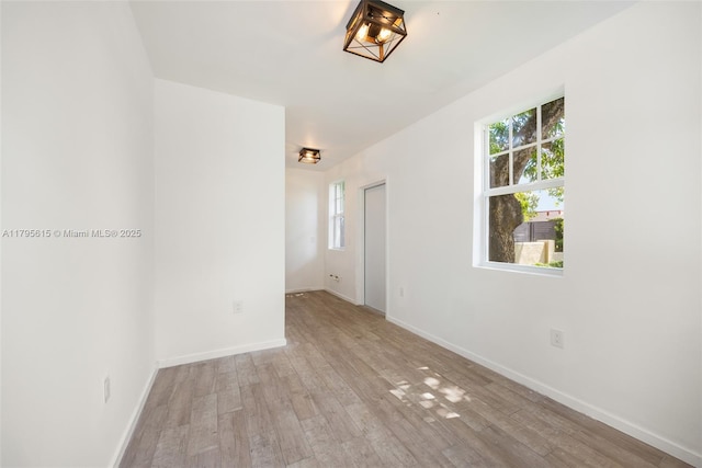 1801 SW 12th St, Miami, FL 33135 - spare room with healthy amount of natural light and wood finished floors