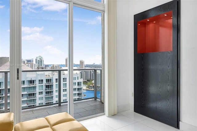 1155 Brickell Bay Dr Unit Ph204, Miami, FL 33131 - tiled bedroom featuring a view of city, multiple windows, access to exterior, and a wall of windows