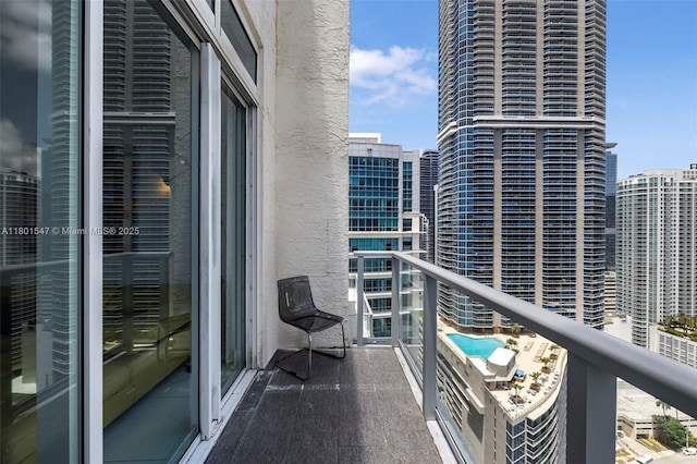 1155 Brickell Bay Dr Unit Ph204, Miami, FL 33131 - balcony with view of pool area and a city view