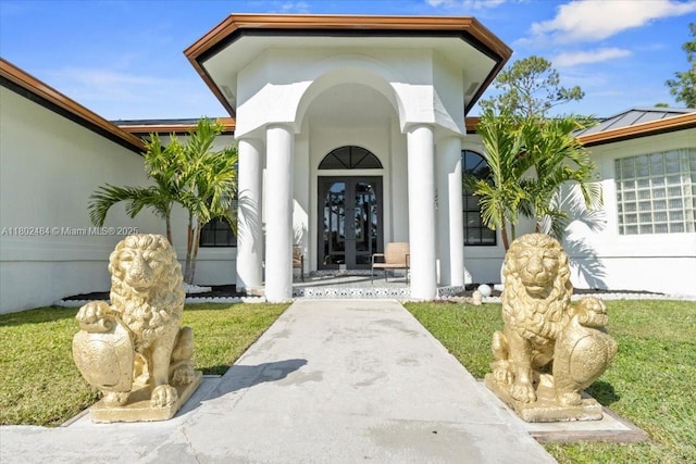 12667 N 79th Ct N, Loxahatchee, FL 33412 - entrance to property featuring french doors, covered porch, and stucco siding