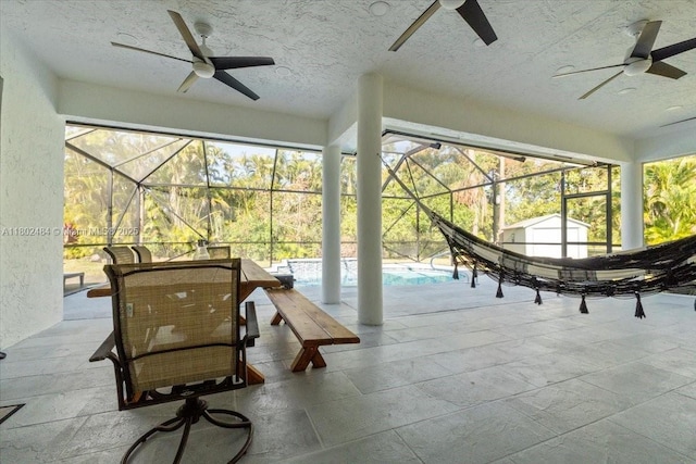 12667 N 79th Ct N, Loxahatchee, FL 33412 - view of patio featuring ceiling fan, a storage unit, an outbuilding, and a lanai