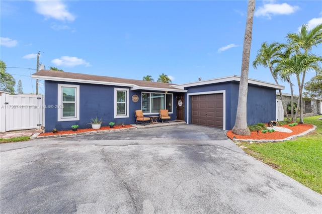 11400 NW 29th Mnr, Sunrise, FL 33323 - single story home with an attached garage, stucco siding, and driveway