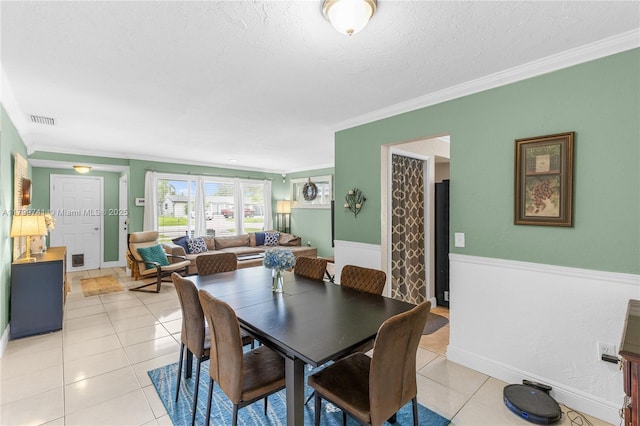11400 NW 29th Mnr, Sunrise, FL 33323 - dining area featuring ornamental molding, light tile patterned floors, a textured ceiling, and baseboards