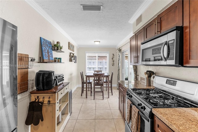 11400 NW 29th Mnr, Sunrise, FL 33323 - kitchen with stainless steel appliances, ornamental molding, light tile patterned floors, a textured ceiling, and open shelves