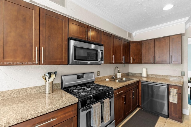 11400 NW 29th Mnr, Sunrise, FL 33323 - kitchen featuring stainless steel appliances, a sink, crown molding, light tile patterned flooring, and light stone countertops