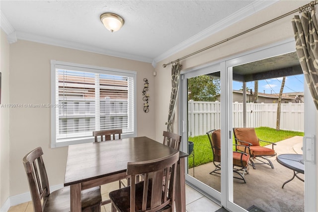 11400 NW 29th Mnr, Sunrise, FL 33323 - dining area featuring ornamental molding, plenty of natural light, baseboards, and a textured ceiling