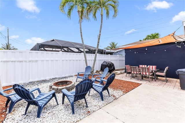 11400 NW 29th Mnr, Sunrise, FL 33323 - fenced backyard featuring a fire pit, a patio area, grilling area, and outdoor dining area