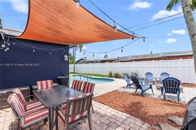 11400 NW 29th Mnr, Sunrise, FL 33323 - fenced backyard with a patio, outdoor dining space, and a fire pit