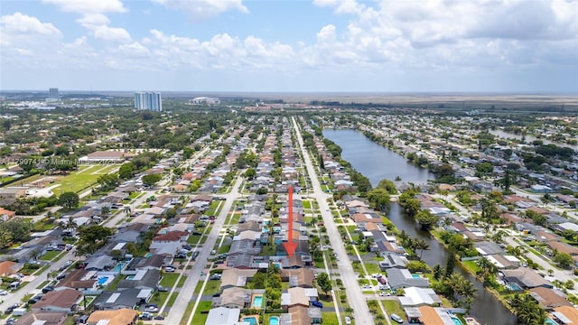 11400 NW 29th Mnr, Sunrise, FL 33323 - aerial view of property and surrounding area featuring nearby suburban area and a large body of water