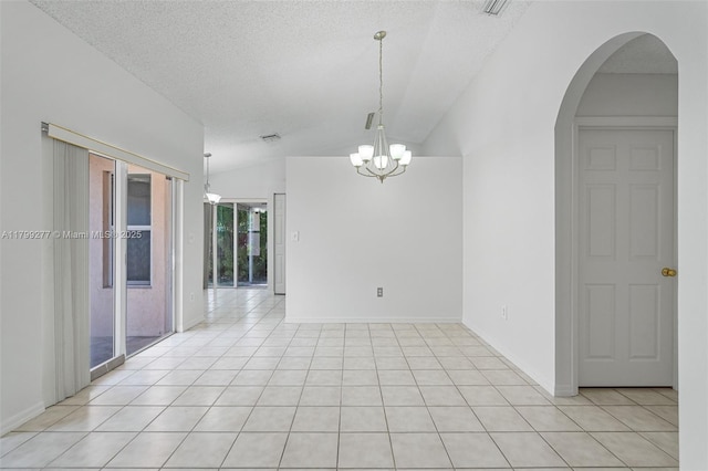 14202 SW 151st Ct, Miami, FL 33196 - unfurnished room with lofted ceiling, a chandelier, light tile patterned floors, arched walkways, and a textured ceiling