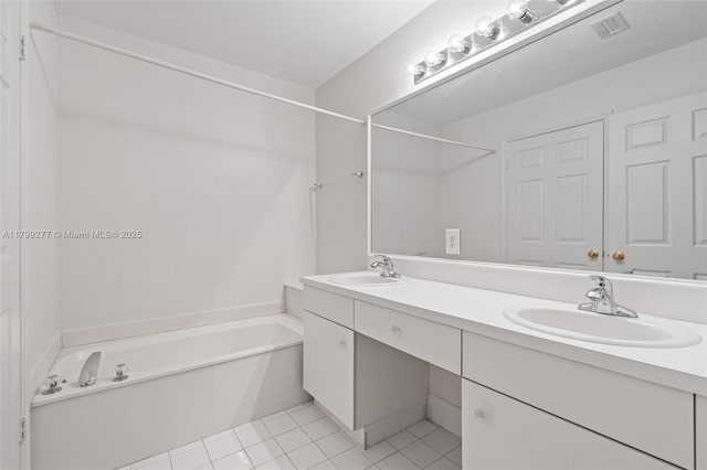 14202 SW 151st Ct, Miami, FL 33196 - bathroom with a tub to relax in, double vanity, and tile patterned flooring