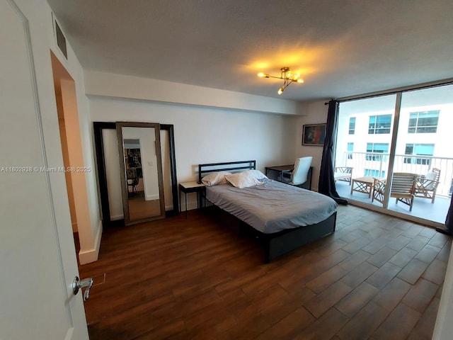 1200 Brickell Bay Dr Unit 3708, Miami, FL 33131 - bedroom featuring dark wood-style floors, expansive windows, baseboards, and access to outside