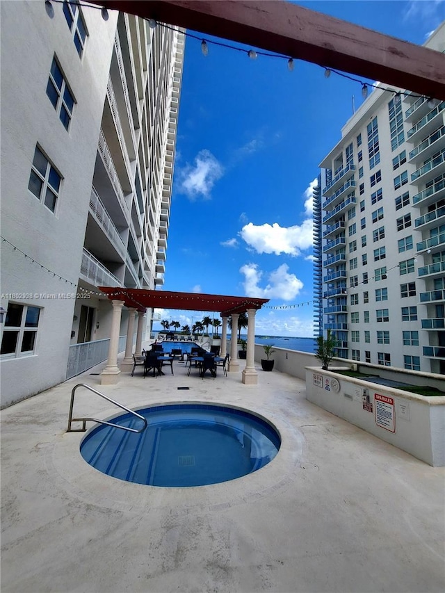 1200 Brickell Bay Dr Unit 3708, Miami, FL 33131 - view of swimming pool with a pool and a patio