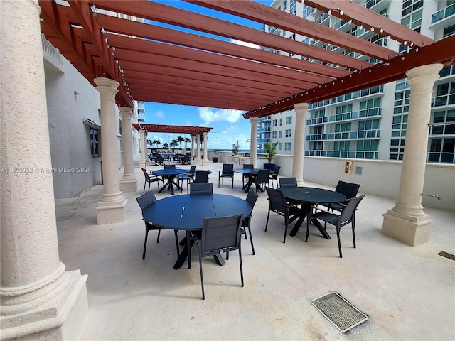 1200 Brickell Bay Dr Unit 3708, Miami, FL 33131 - view of patio / terrace featuring outdoor dining area and a pergola