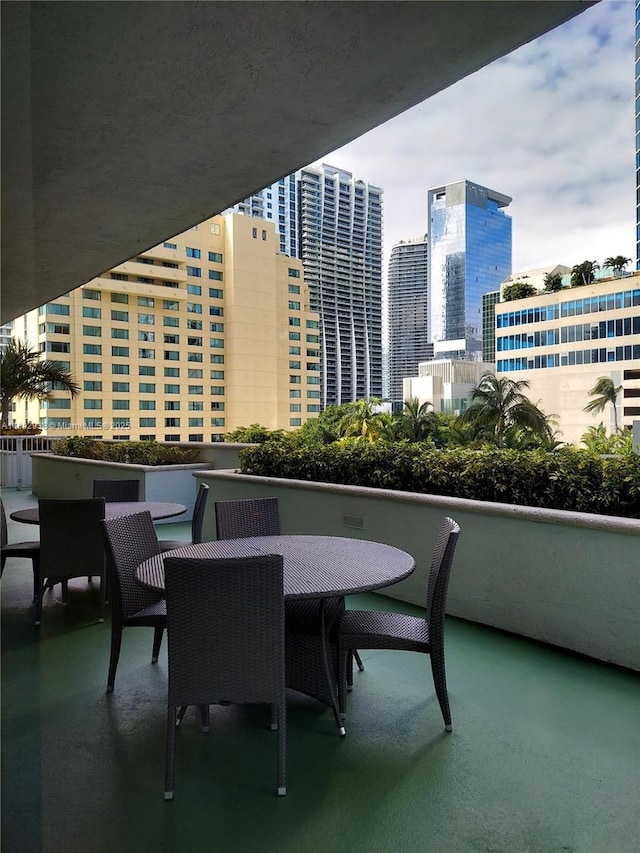 1200 Brickell Bay Dr Unit 3708, Miami, FL 33131 - balcony with outdoor dining space and a city view