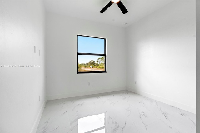 1222 Hibiscus, Lehigh Acres, FL 33972 - unfurnished room with baseboards, ceiling fan, and marble look tiles