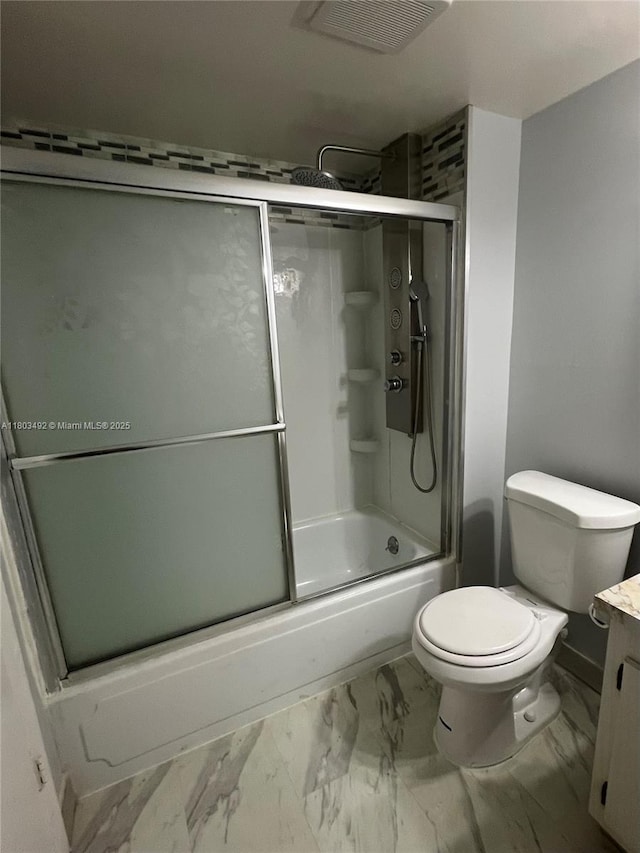 609 S State Road 7 Unit 2H, Margate, FL 33068 - full bathroom featuring marble finish floors, vanity, toilet, and bath / shower combo with glass door