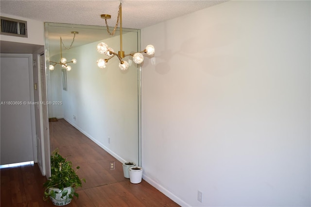 9121 Sunrise Lakes Blvd Unit 201, Sunrise, FL 33322 - unfurnished dining area with wood finished floors, a chandelier, and baseboards