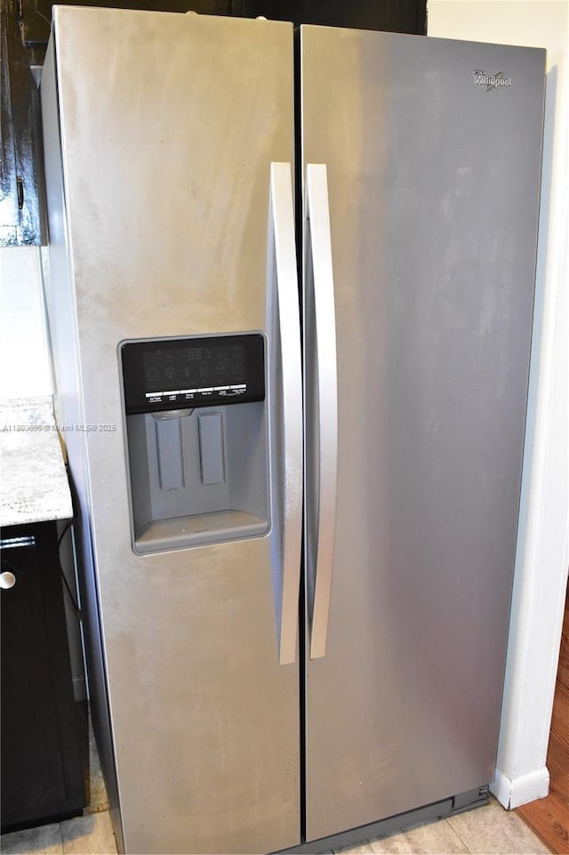 9121 Sunrise Lakes Blvd Unit 201, Sunrise, FL 33322 - kitchen view of stainless steel fridge, light countertops, and dark cabinetry