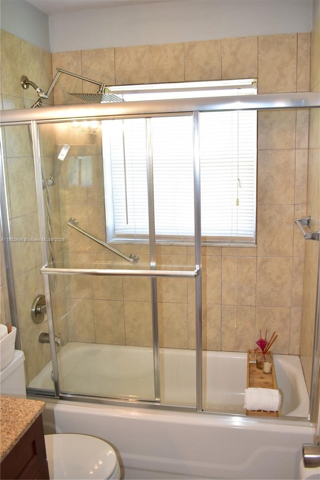 9121 Sunrise Lakes Blvd Unit 201, Sunrise, FL 33322 - full bathroom featuring toilet, enclosed tub / shower combo, and vanity