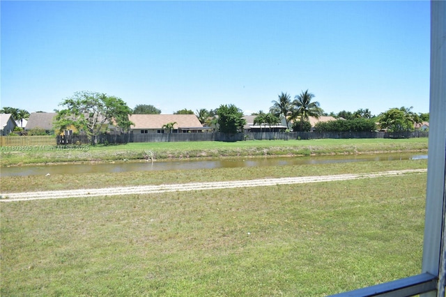 9121 Sunrise Lakes Blvd Unit 201, Sunrise, FL 33322 - view of yard featuring a water view and fence