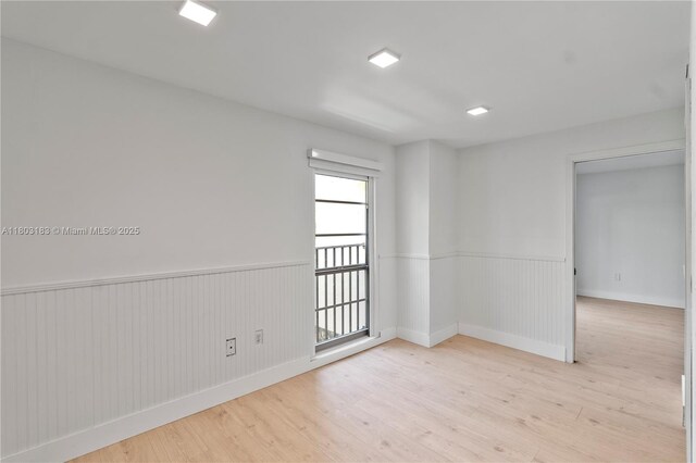 6886 N Kendall Dr Unit D207, Pinecrest, FL 33156 - empty room with wainscoting, light wood finished floors, and baseboards
