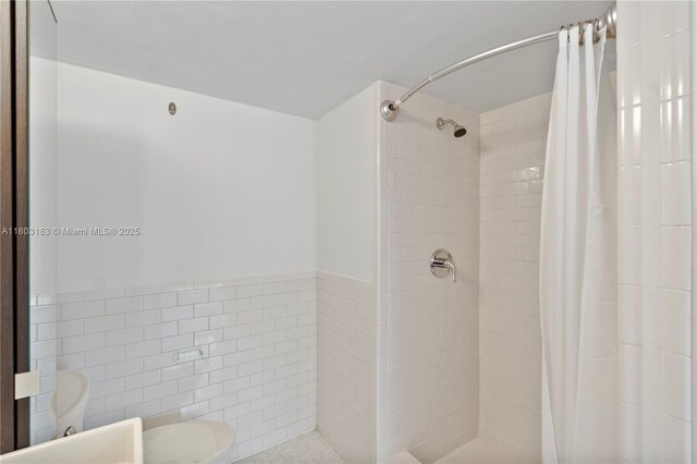 6886 N Kendall Dr Unit D207, Pinecrest, FL 33156 - bathroom featuring toilet, a stall shower, and tile walls