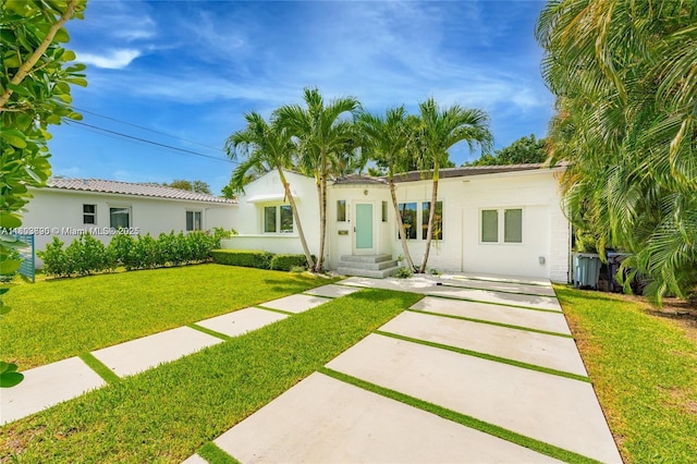 5120 Cherokee Ave, Miami Beach, FL 33140 - view of front of home with a front yard and stucco siding