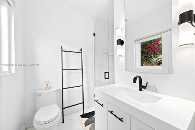 5120 Cherokee Ave, Miami Beach, FL 33140 - bathroom with a marble finish shower, toilet, vanity, and baseboards